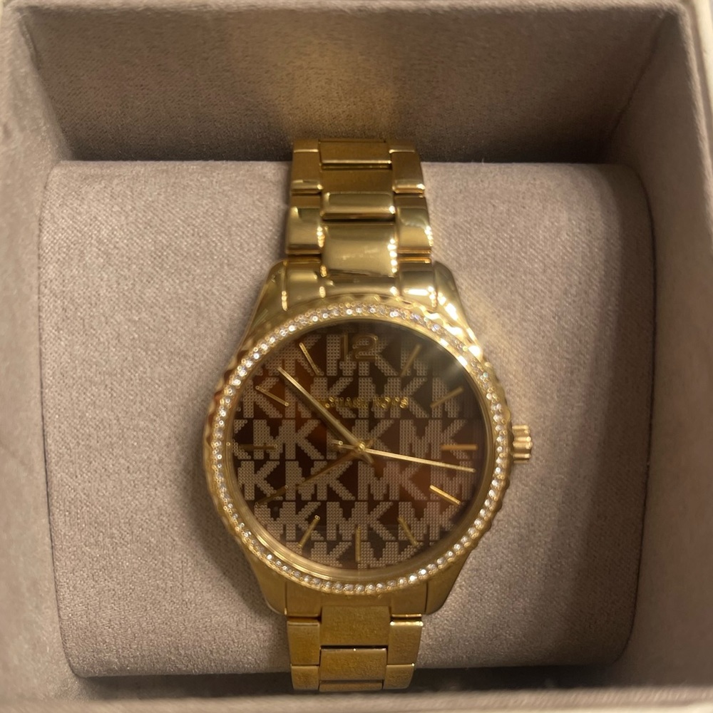 Never worn gold Michael Kors watch.